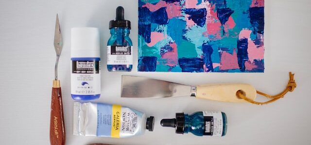 art supplies with canvas and brushes